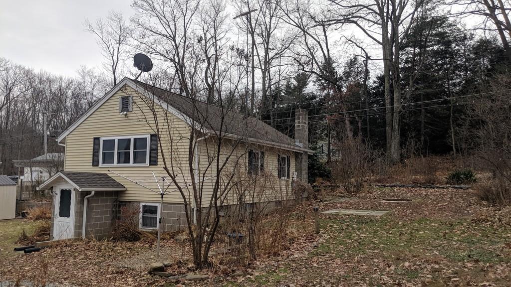 66 Osgood Road Charlton, MA 01507 - Photo 14 of 42 a front view of a house with garden