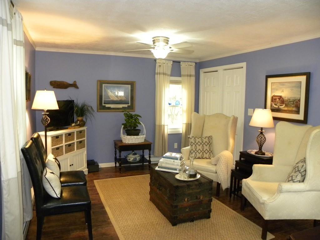66 Osgood Road Charlton, MA 01507 - Photo 22 of 42 a living room with furniture a lamp and a chandelier