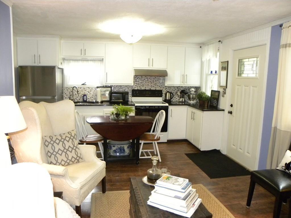 66 Osgood Road Charlton, MA 01507 - Photo 24 of 42 a living room with furniture and a flat screen tv