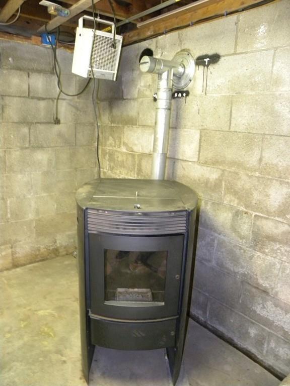 66 Osgood Road Charlton, MA 01507 - Photo 28 of 42 a fireplace with a window