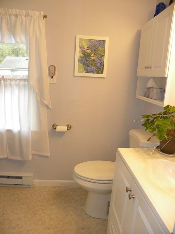 66 Osgood Road Charlton, MA 01507 - Photo 32 of 42 a bathroom with a sink mirror vanity and toilet