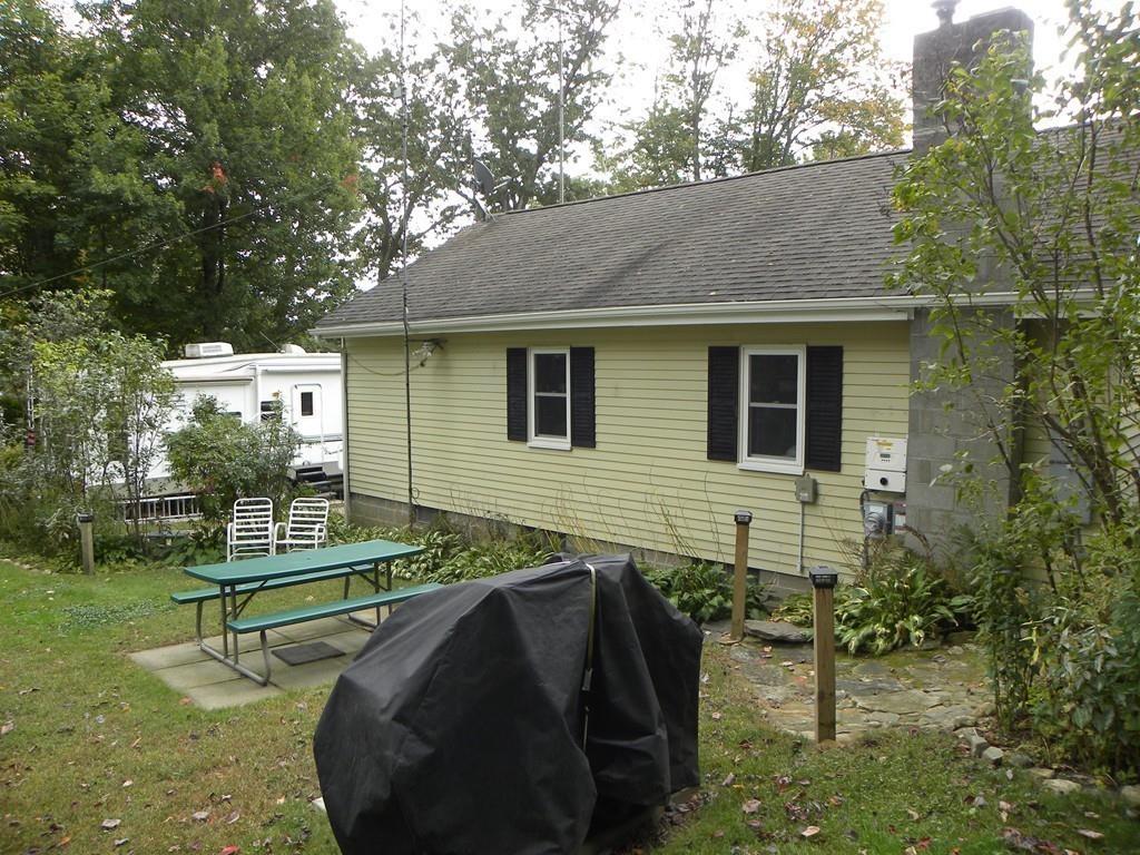 66 Osgood Road Charlton, MA 01507 - Photo 39 of 42 a view of backyard with outdoor seating and green space