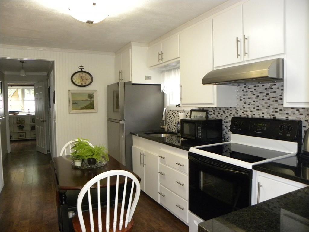 66 Osgood Road Charlton, MA 01507 - Photo 4 of 42 a kitchen with stainless steel appliances granite countertop a stove refrigerator and a view of living room