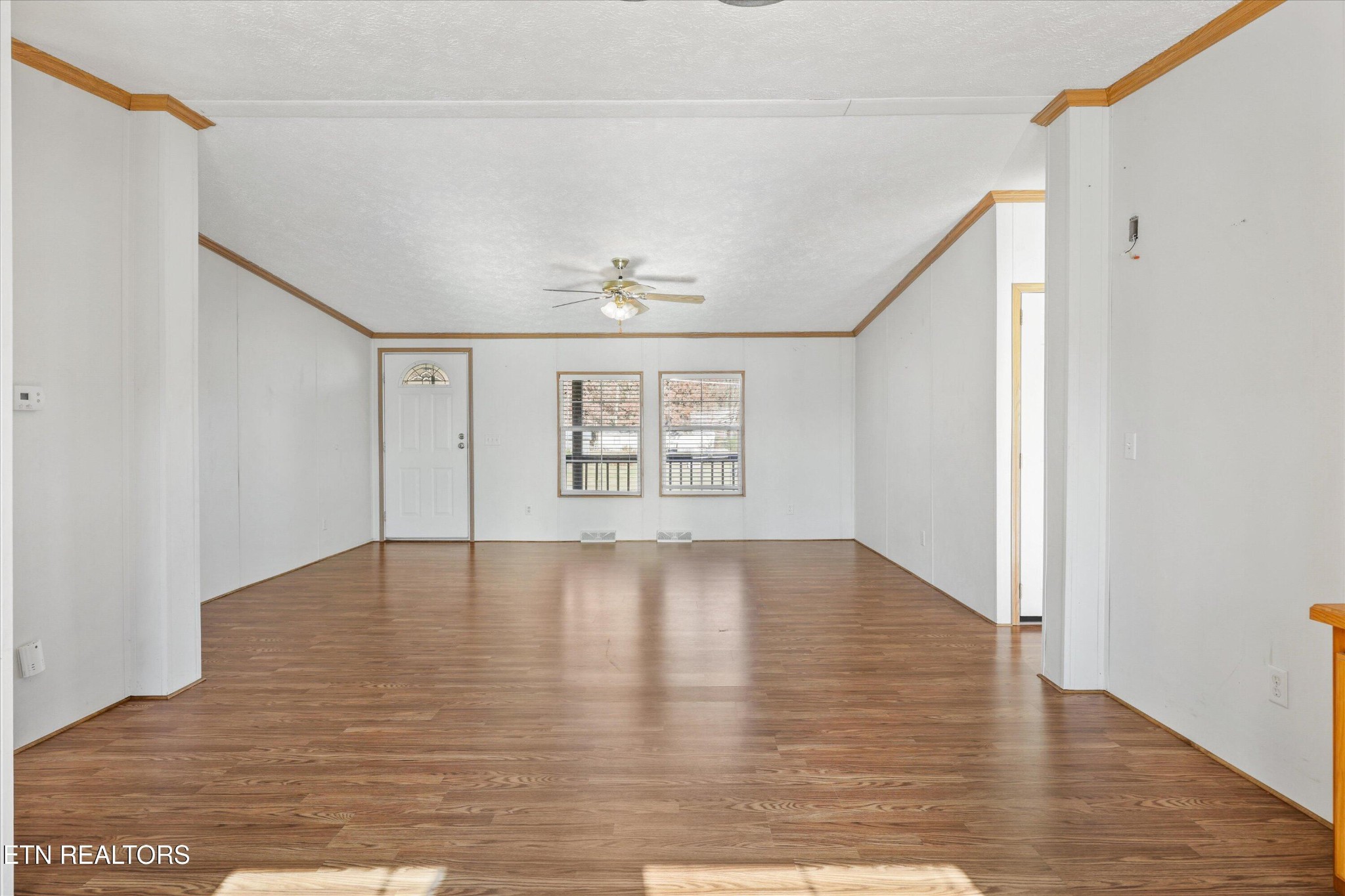 1130 Williamson Chapel Road Maryville, TN 37801 - Photo 9 of 36 a view of an empty room with wooden floor and a window