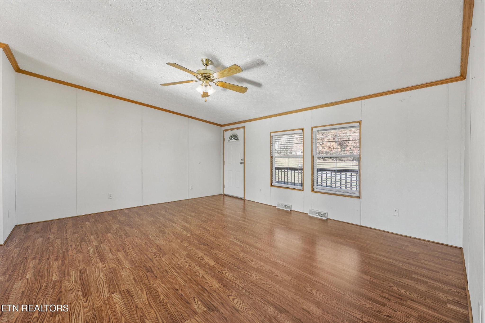 1130 Williamson Chapel Road Maryville, TN 37801 - Photo 10 of 36 a view of an empty room with a window and wooden floor