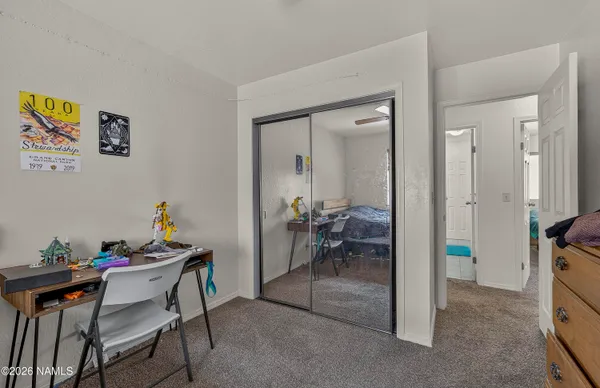 a dining room with furniture and a view of bathroom