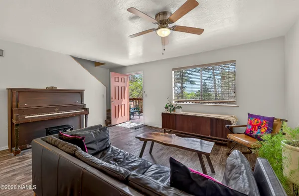 a living room with furniture and a window