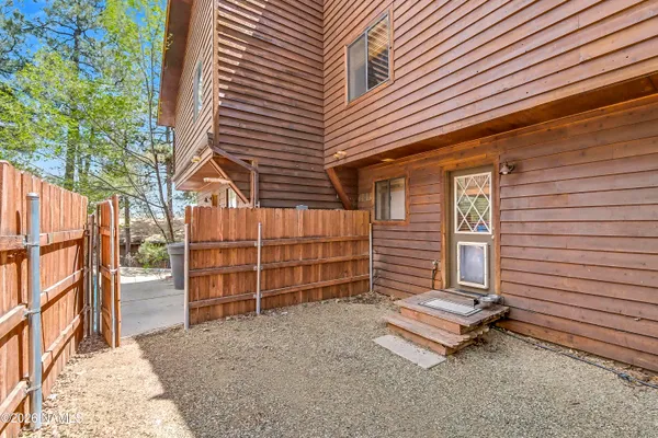 an aerial view of a house with lots of trees