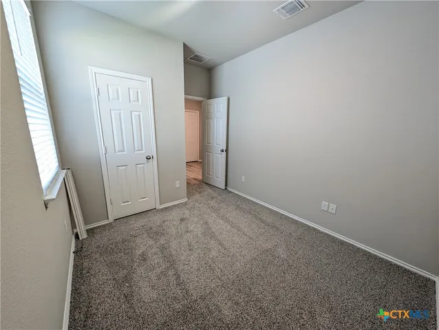 a kitchen with stainless steel appliances a refrigerator a stove a sink a washer dryer and a refrigerator