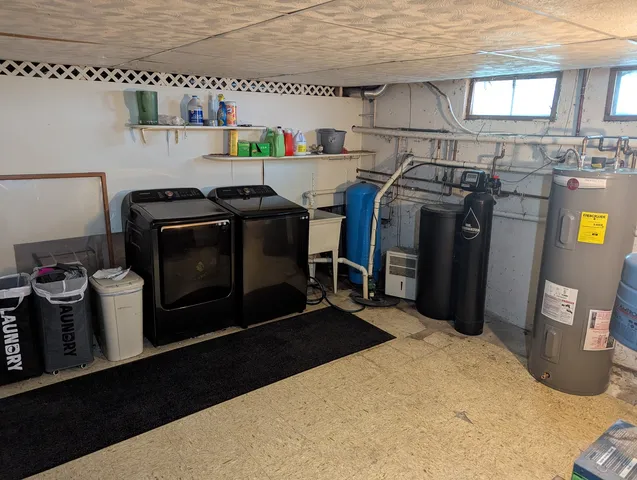 a kitchen with stainless steel appliances a stove a microwave and a refrigerator