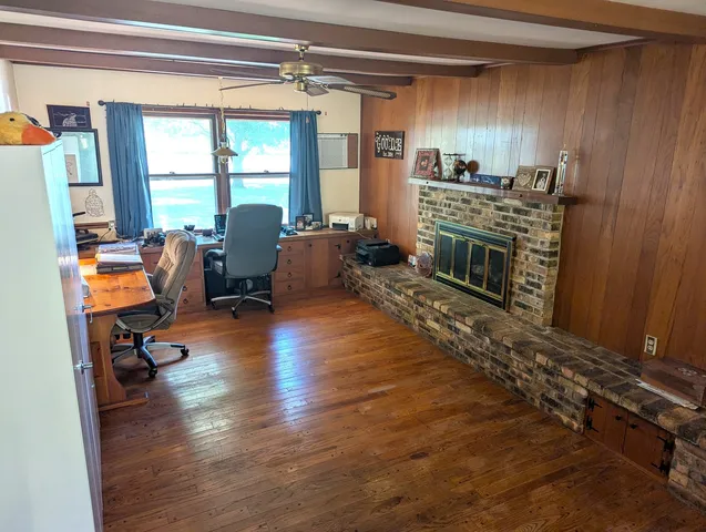 a living room with furniture windows and a fireplace