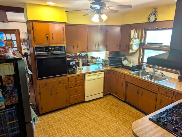 a kitchen with a sink stove and microwave