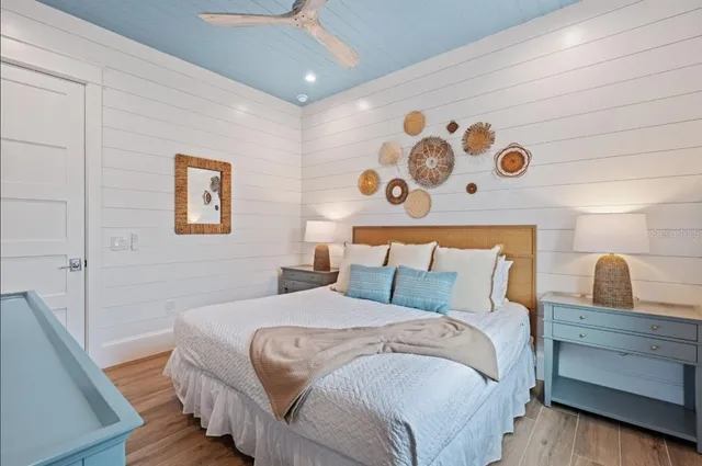 a living room with a couch and a table with wooden floor