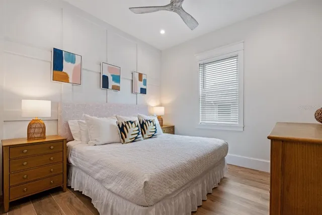 a bedroom with a bed and a lamp