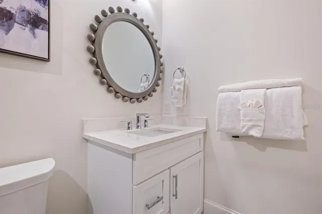 a bathroom with a double vanity sink mirror and shower