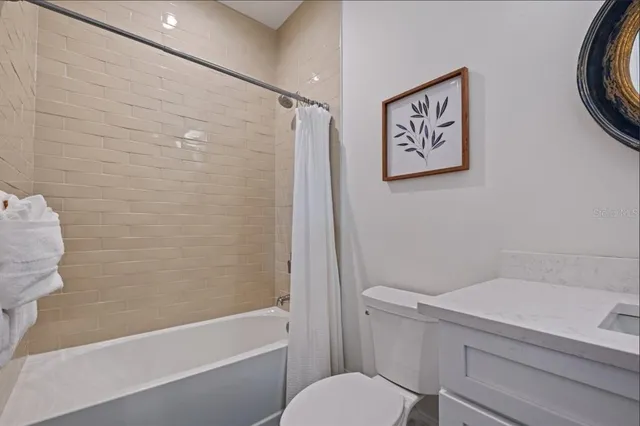 a room with furniture and a floor to ceiling window