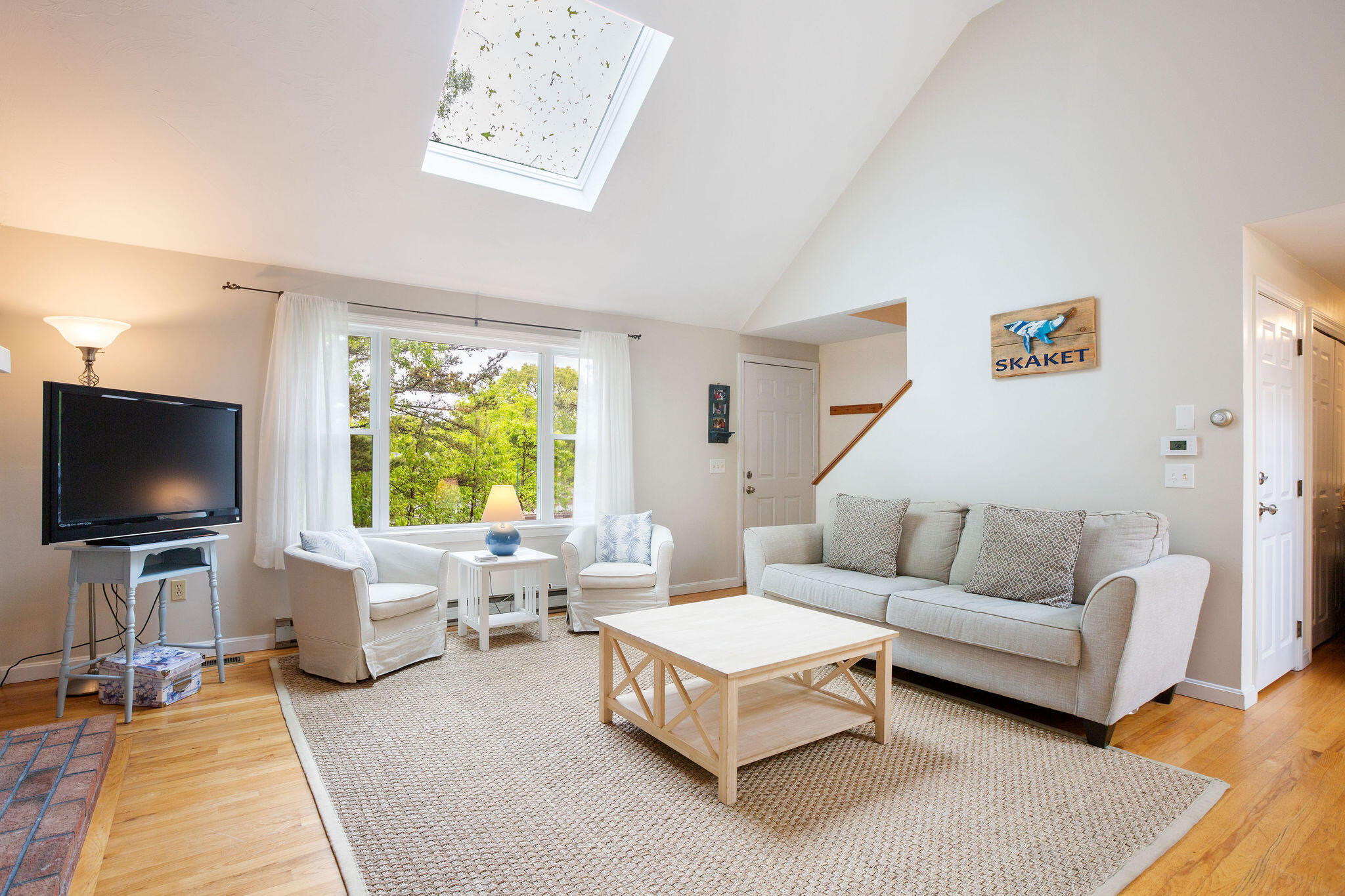 94 Pine View Drive Brewster, MA 02631 - Photo 14 of 51 a living room with furniture and a flat screen tv