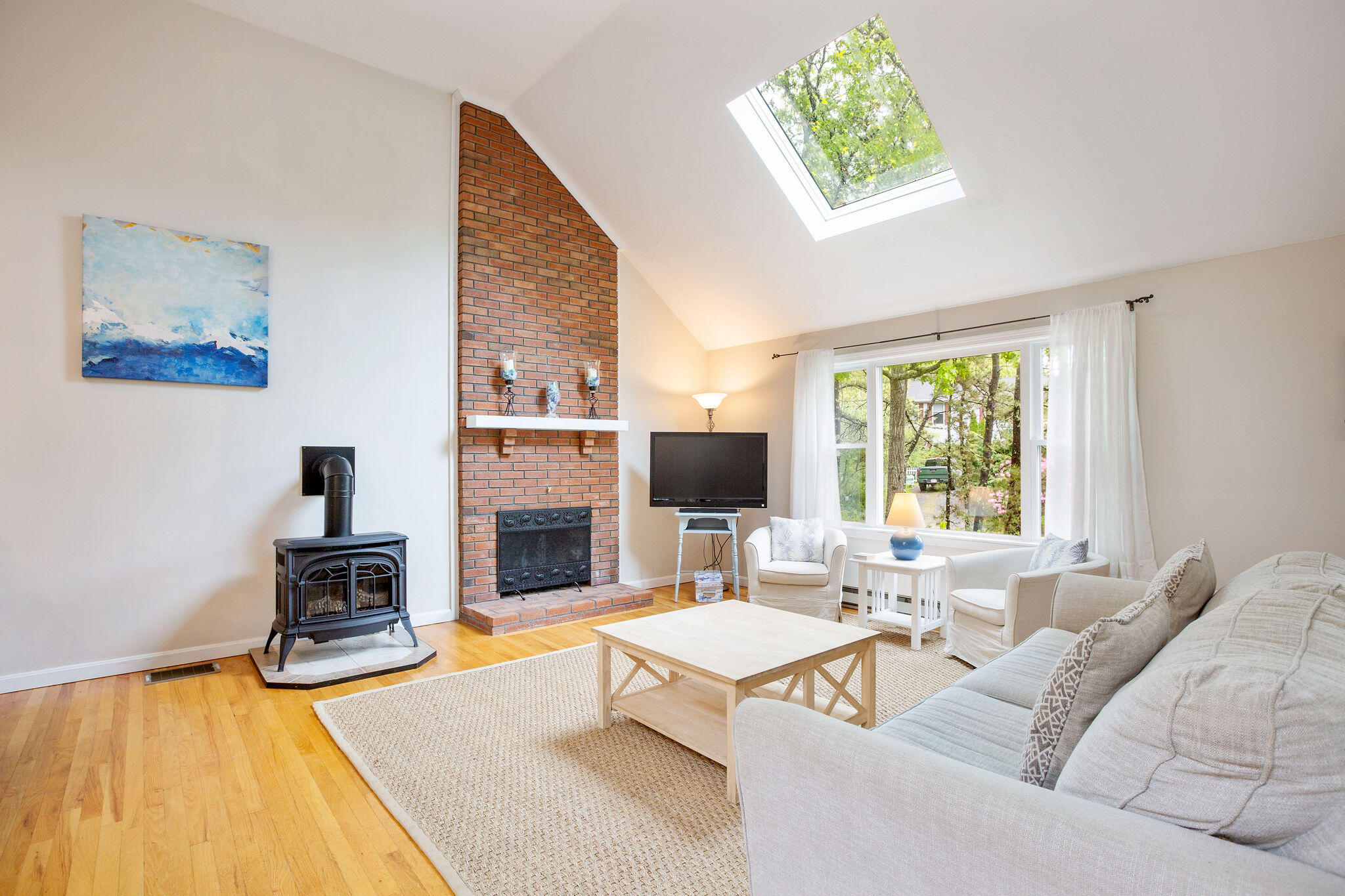 94 Pine View Drive Brewster, MA 02631 - Photo 16 of 51 a living room with furniture fireplace and a large window
