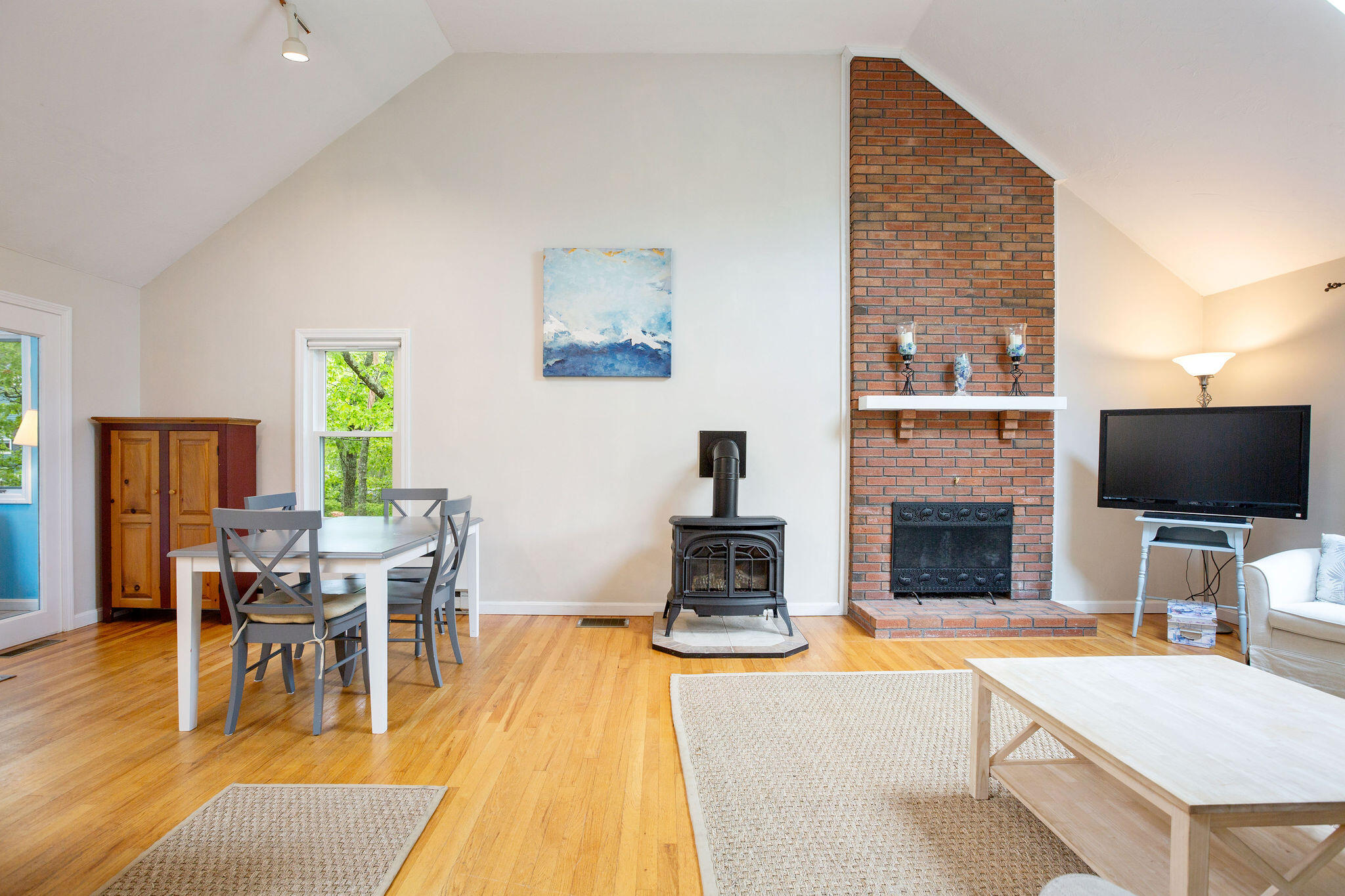 94 Pine View Drive Brewster, MA 02631 - Photo 17 of 51 a living room with furniture a fireplace and a flat screen tv