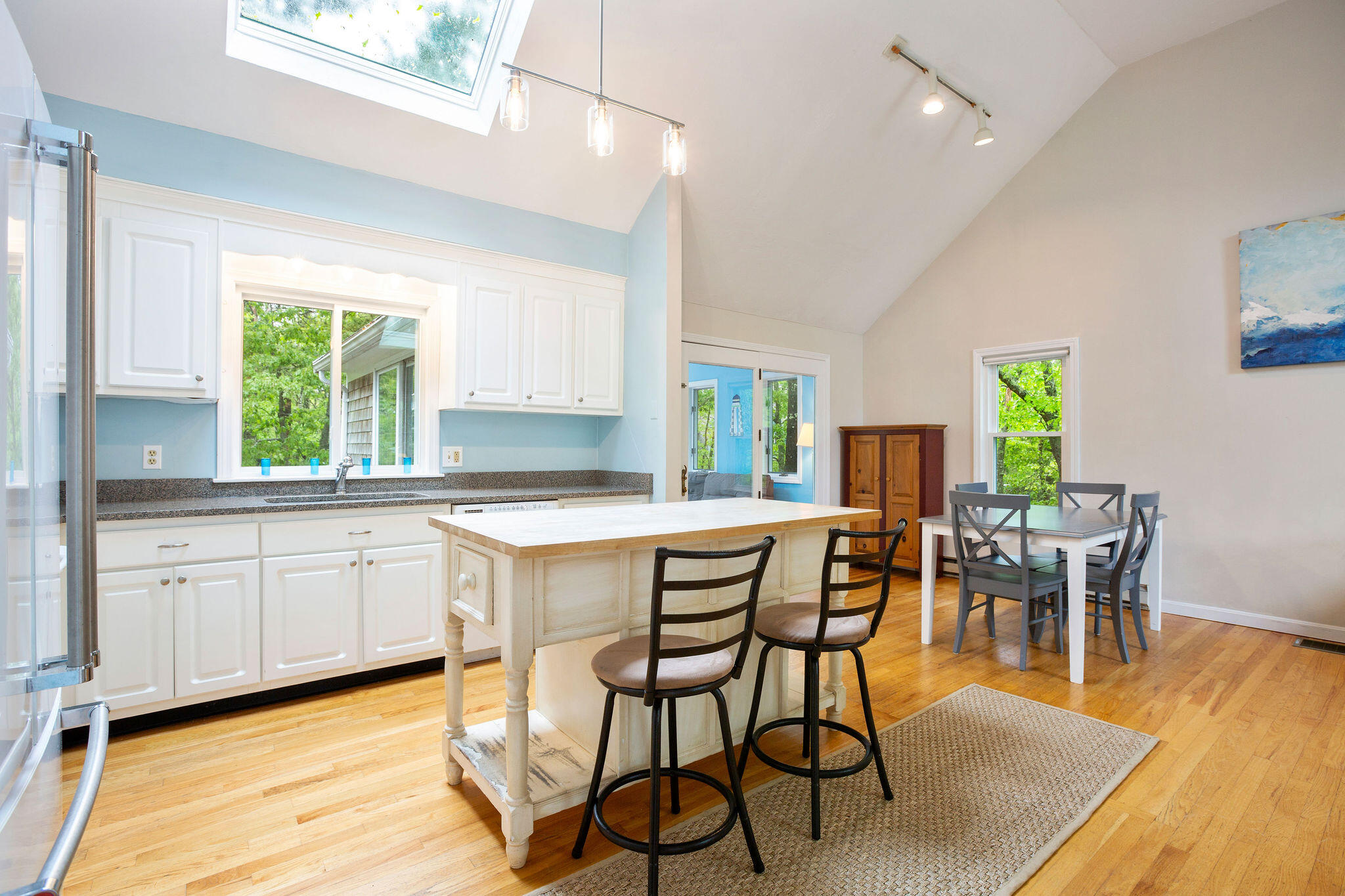 94 Pine View Drive Brewster, MA 02631 - Photo 22 of 51 a kitchen with a dining table chairs and window