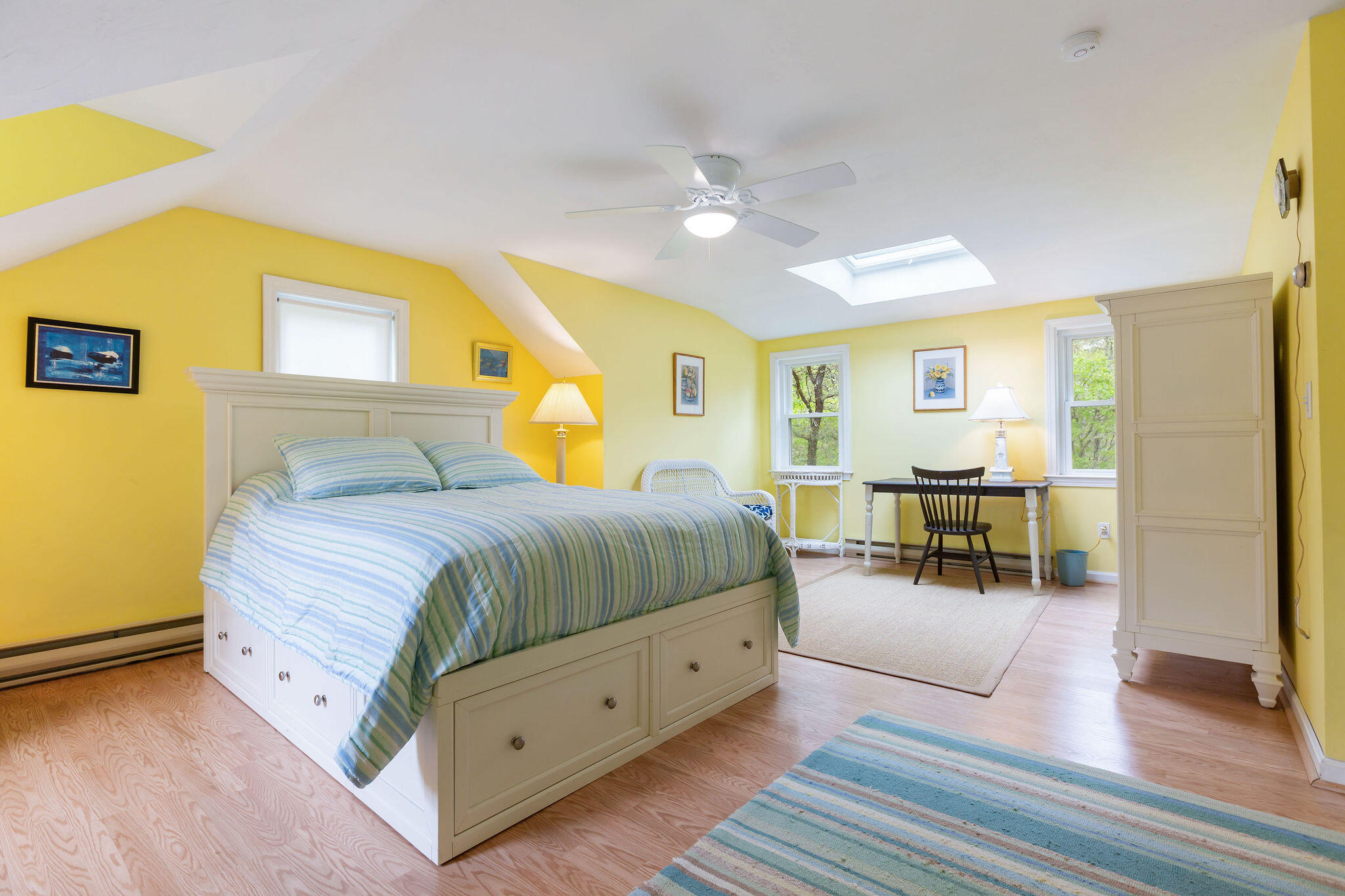 94 Pine View Drive Brewster, MA 02631 - Photo 37 of 51 a spacious bedroom with a bed and a table in it