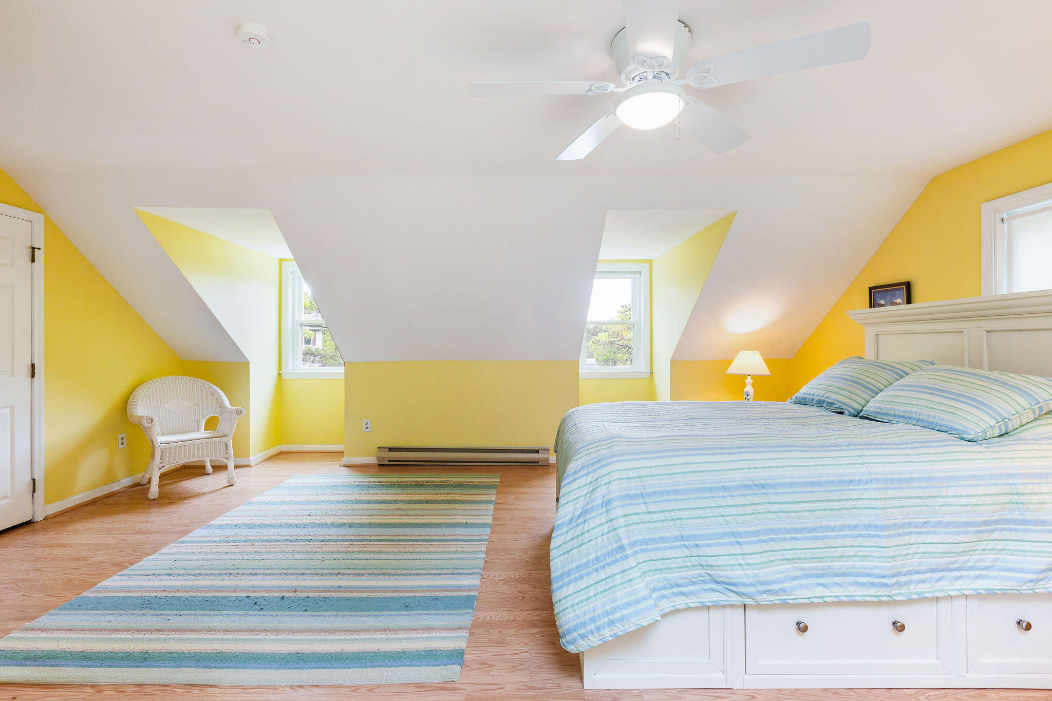 94 Pine View Drive Brewster, MA 02631 - Photo 39 of 51 a bedroom with a bed and wooden floor