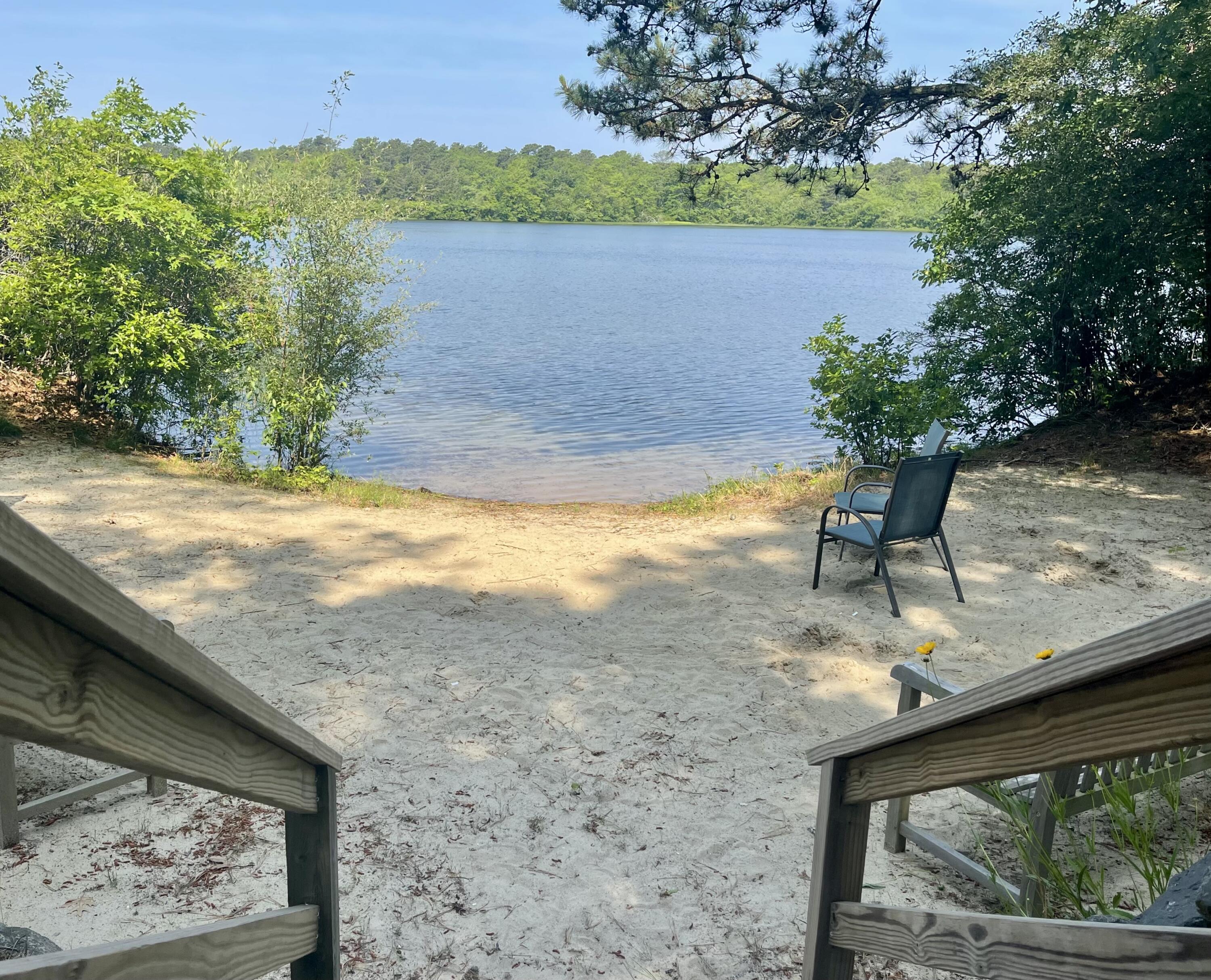 94 Pine View Drive Brewster, MA 02631 - Photo 46 of 51 a view of a lake with a mountain in the background