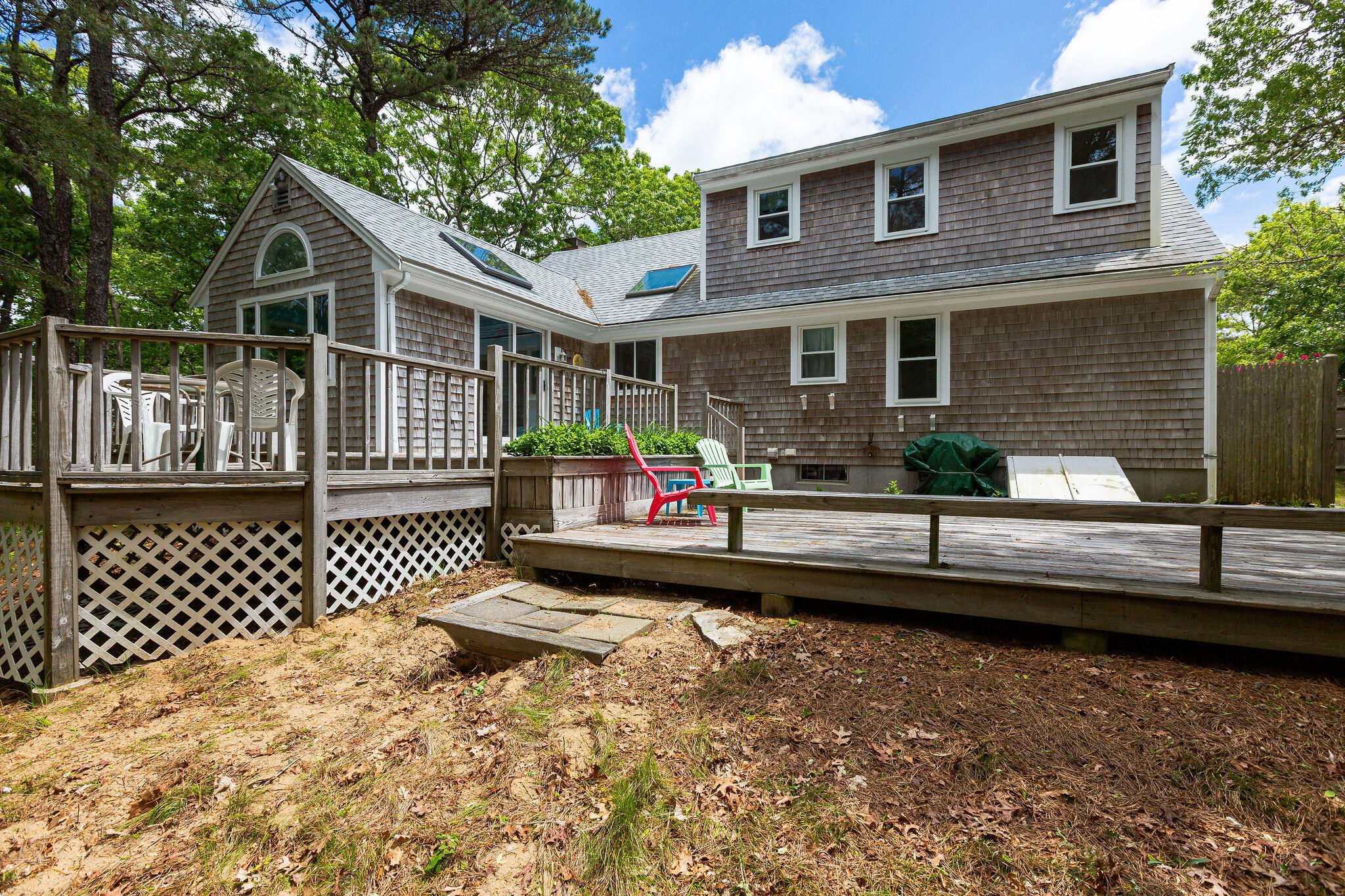 94 Pine View Drive Brewster, MA 02631 - Photo 5 of 51 a front view of a house with a yard