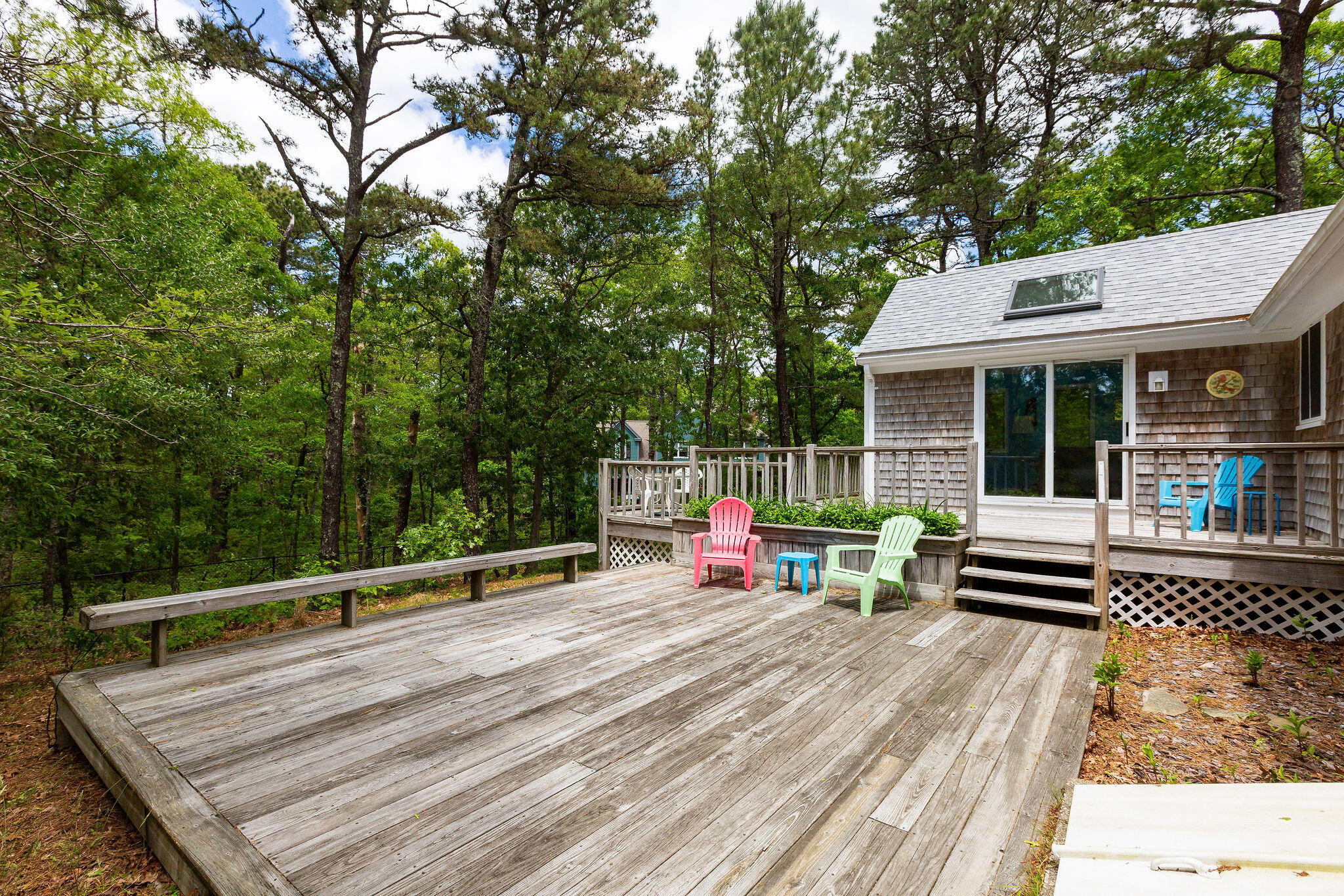 94 Pine View Drive Brewster, MA 02631 - Photo 6 of 51 a view of a roof deck with wooden floor and fence