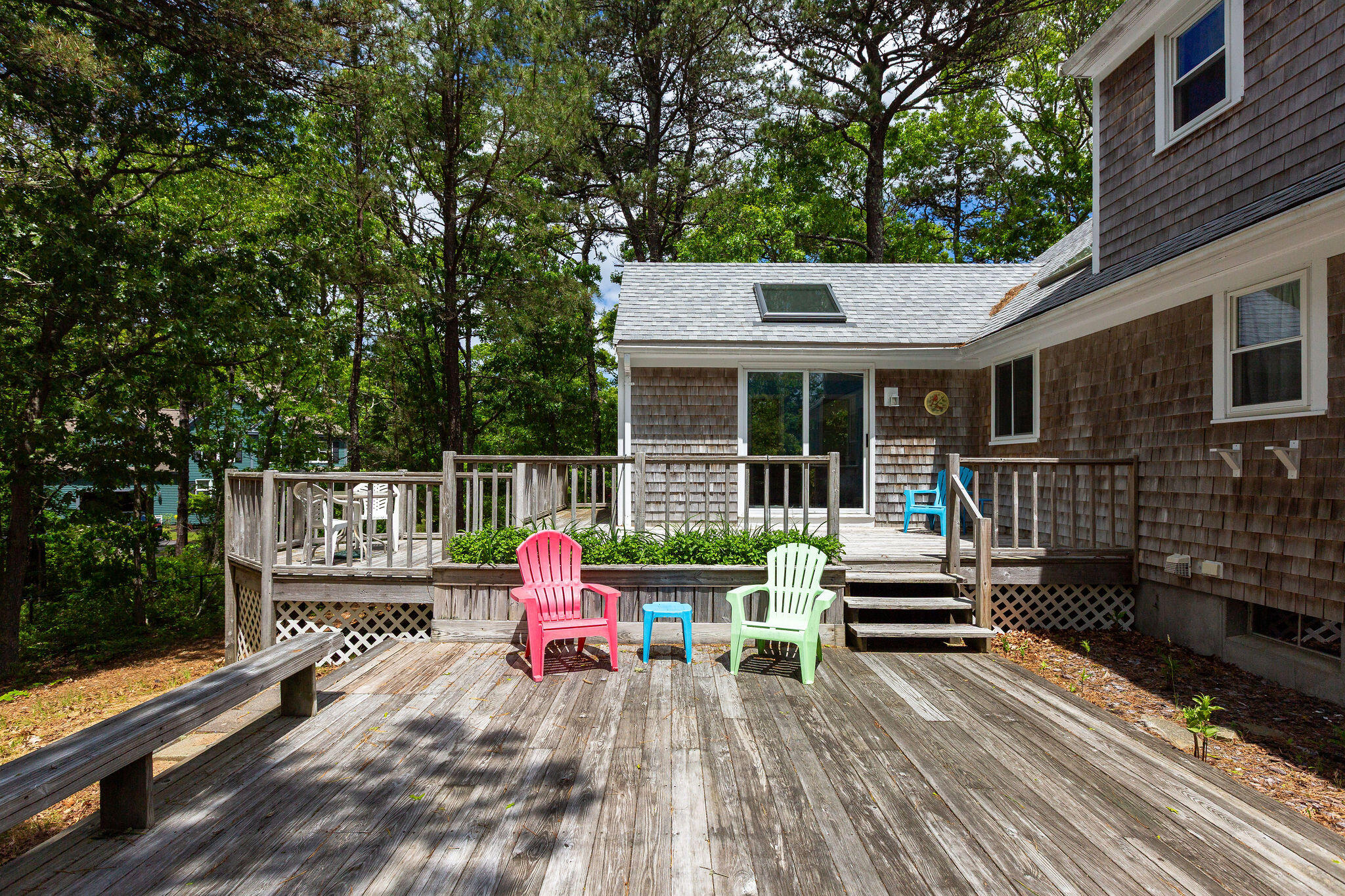 94 Pine View Drive Brewster, MA 02631 - Photo 7 of 51 a view of house with deck outdoor seating and yard