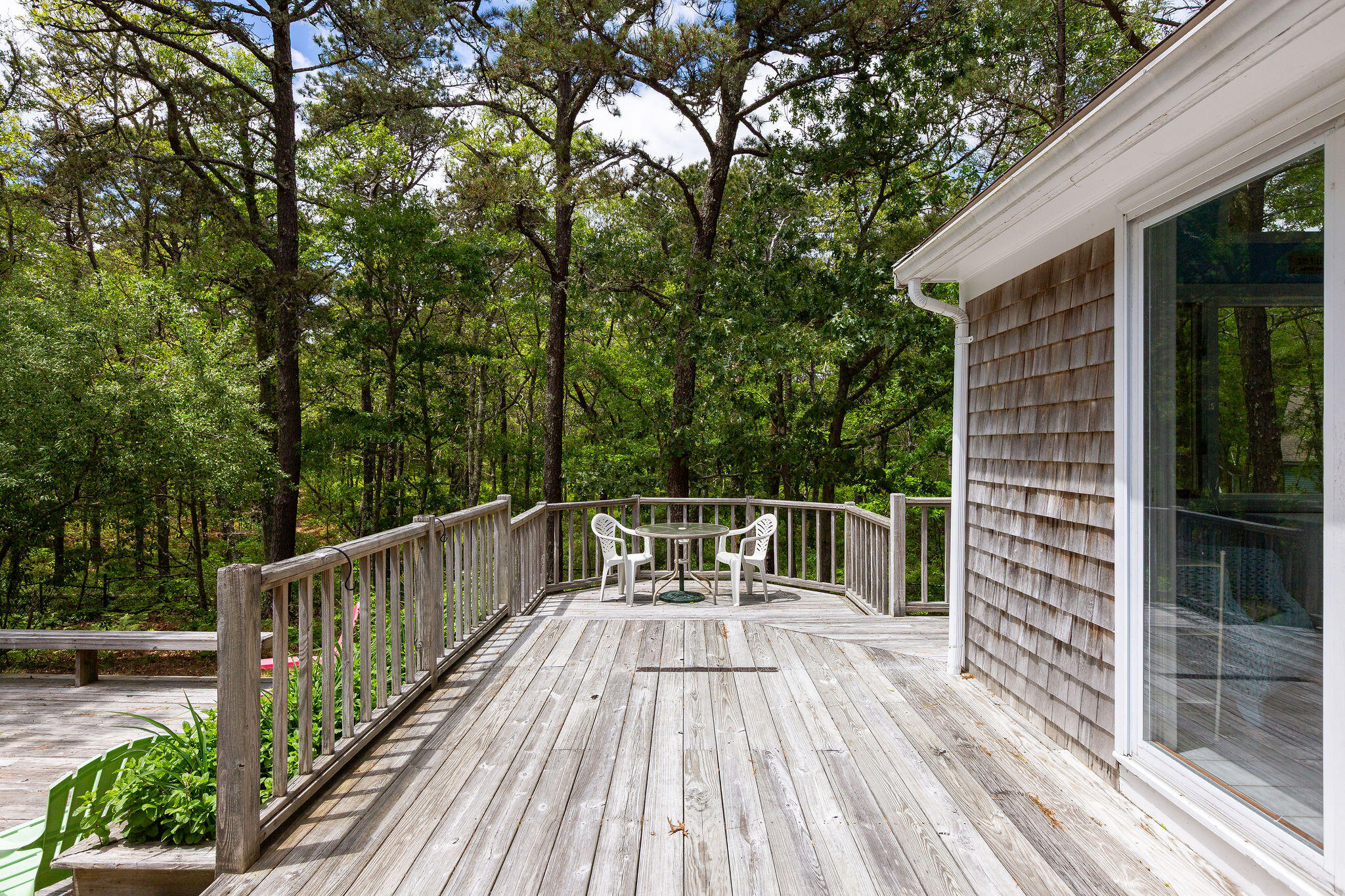 94 Pine View Drive Brewster, MA 02631 - Photo 9 of 51 a balcony with wooden floor and fence