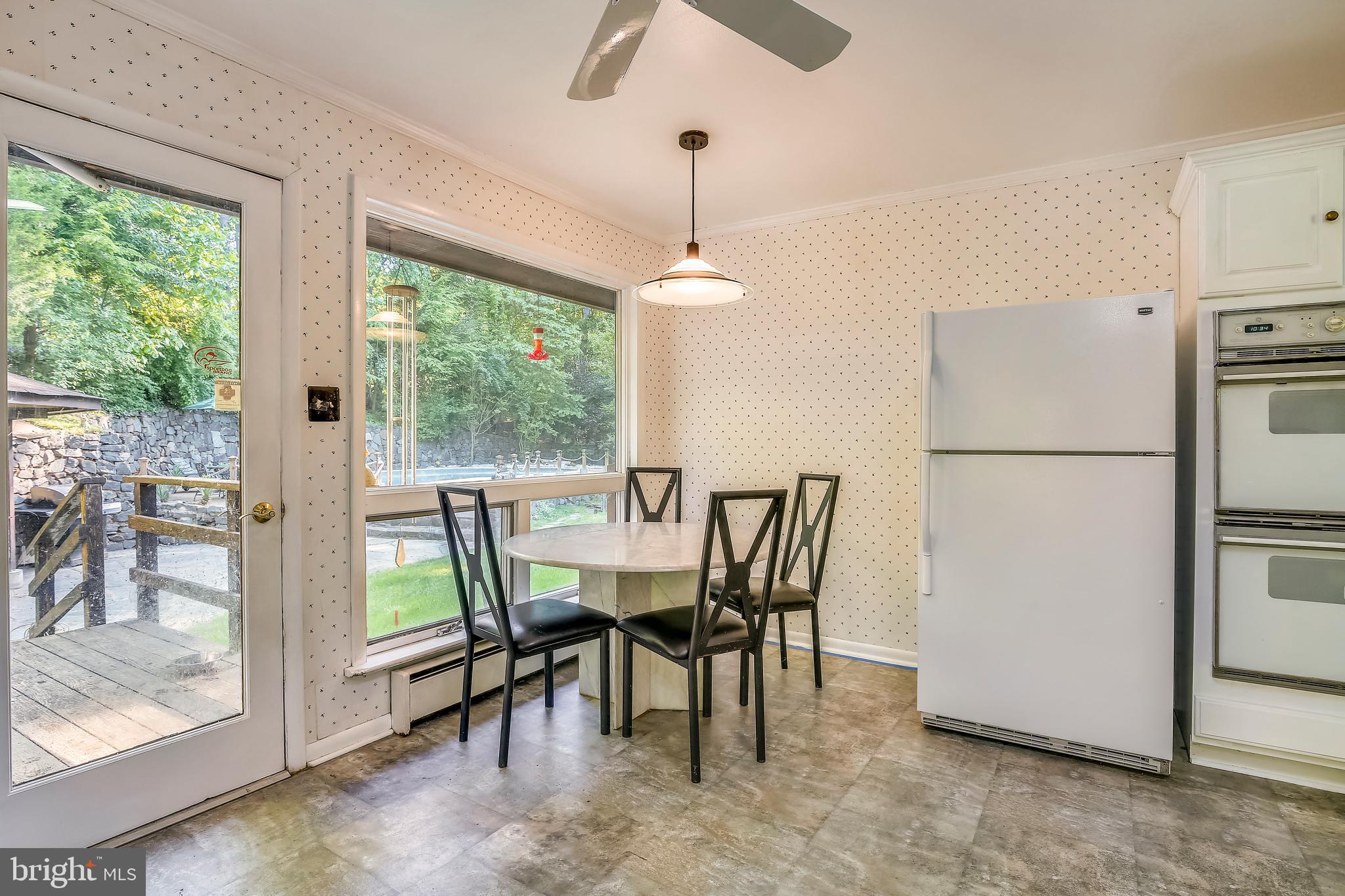 10614 Hunters Valley Road Vienna, VA 22181 - Photo 19 of 37 Eat-in kitchen opens to rear deck.