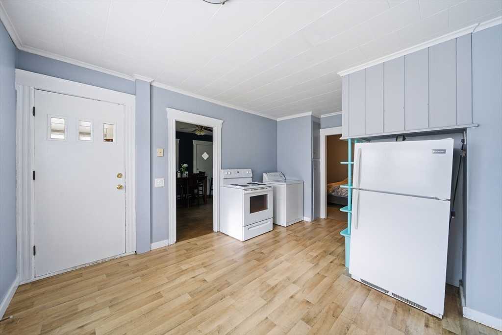 31 Whitcomb Street Webster, MA 01570 - Photo 17 of 39 a kitchen with a refrigerator a stove top oven and cabinets