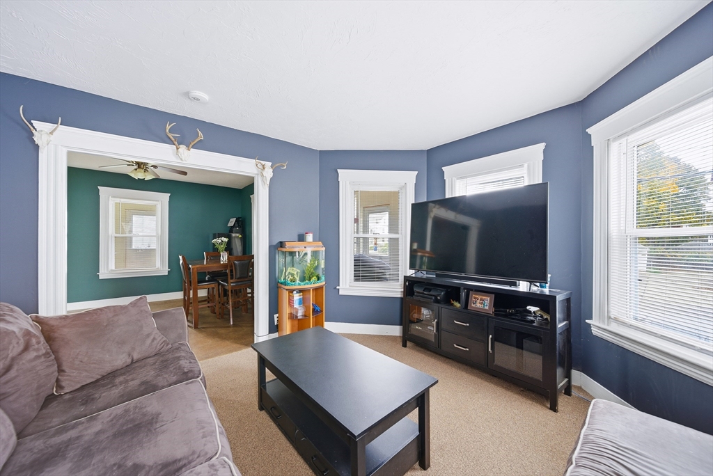 31 Whitcomb Street Webster, MA 01570 - Photo 18 of 39 a living room with furniture and a flat screen tv