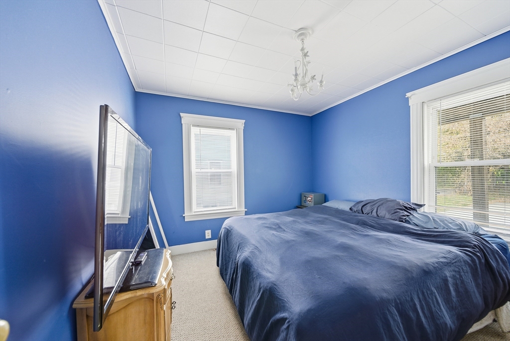 31 Whitcomb Street Webster, MA 01570 - Photo 23 of 39 a bedroom with a bed next to a window