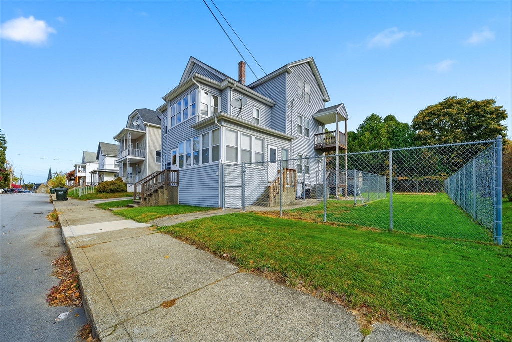 31 Whitcomb Street Webster, MA 01570 - Photo 30 of 39 a front view of a house with a yard