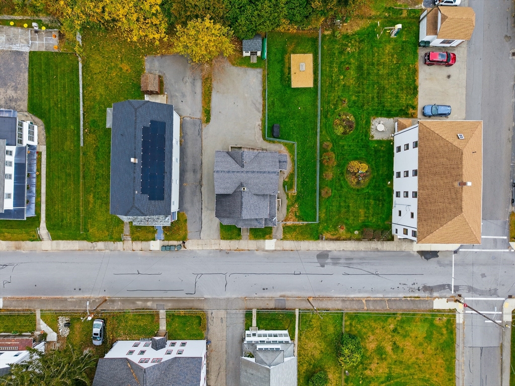 31 Whitcomb Street Webster, MA 01570 - Photo 38 of 39 an aerial view of a house with a yard and large tree