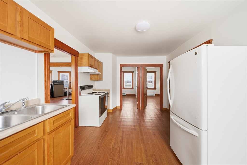 31 Whitcomb Street Webster, MA 01570 - Photo 4 of 39 a kitchen with stainless steel appliances granite countertop a refrigerator and a stove top oven