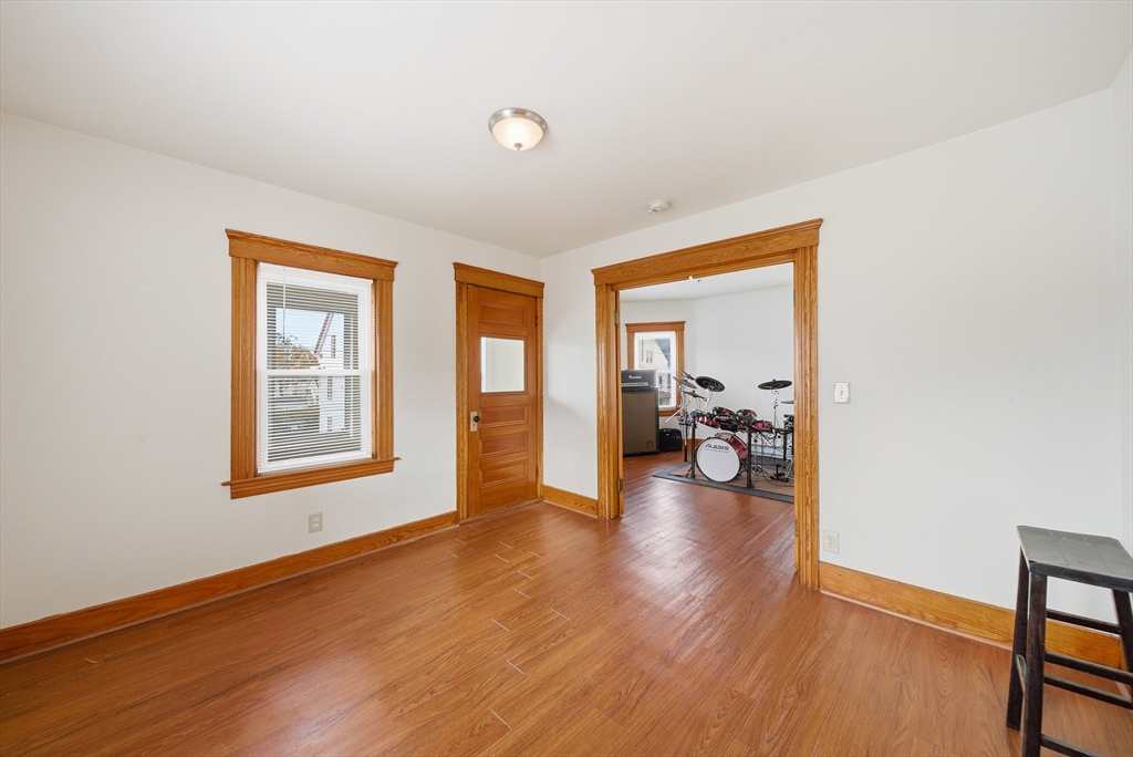 31 Whitcomb Street Webster, MA 01570 - Photo 6 of 39 a view of livingroom with hardwood floor and a window