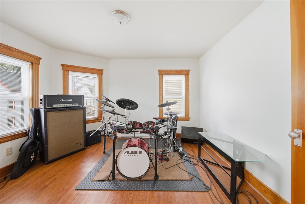 31 Whitcomb Street Webster, MA 01570 - Photo 8 of 39 a work room with furniture and wooden floor