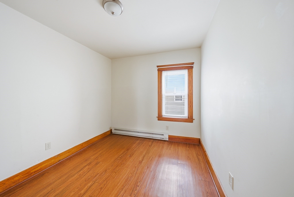 31 Whitcomb Street Webster, MA 01570 - Photo 10 of 39 an empty room with wooden floor and windows