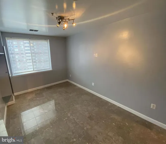 a spacious bathroom with a double vanity sink toilet and mirror