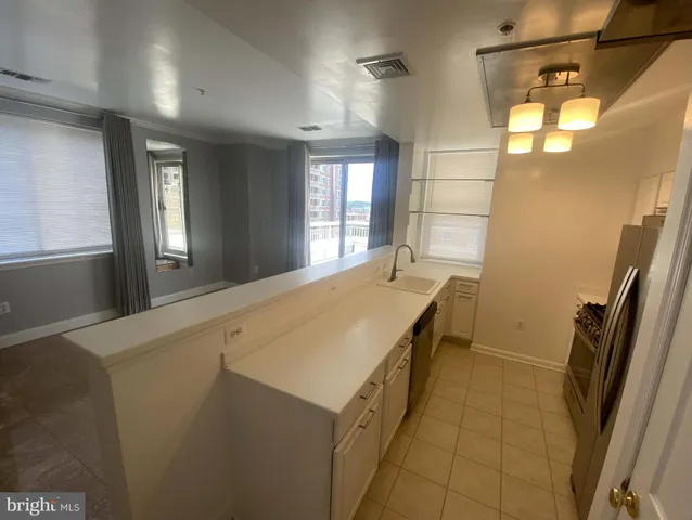 a spacious bathroom with a double vanity sink and mirror