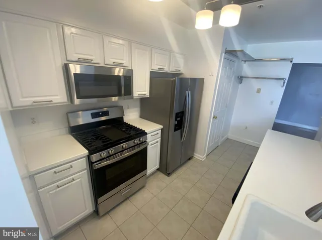 a utility room with washer and dryer