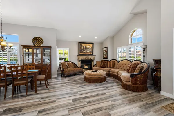 a view of a patio with a table and chairs under an umbrella