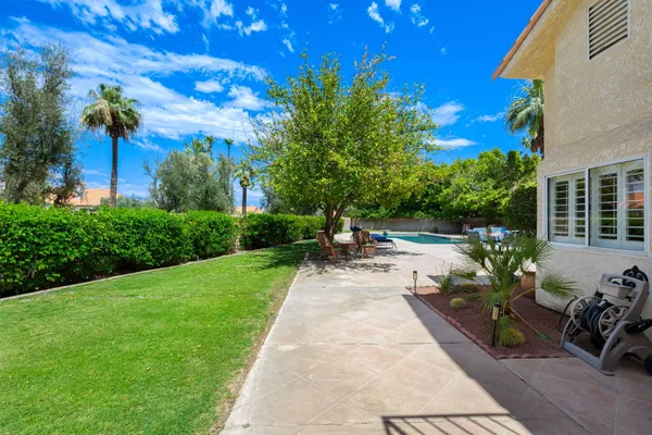 a view of a swimming pool and lounge chair
