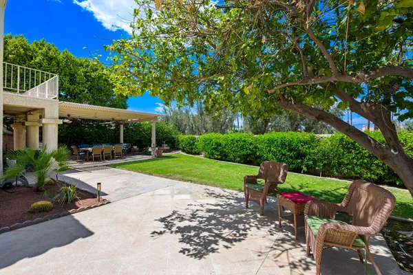a view of a swimming pool and a yard