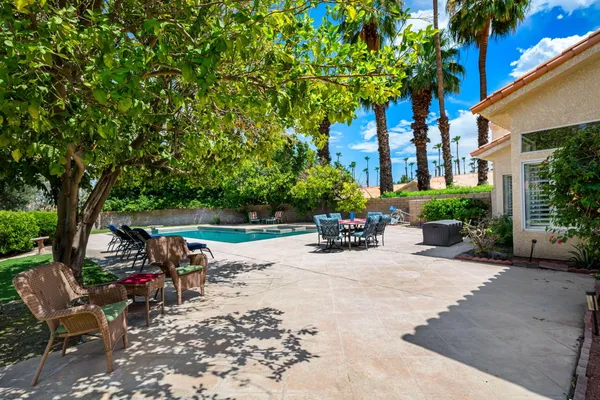 a view of swimming pool with a patio
