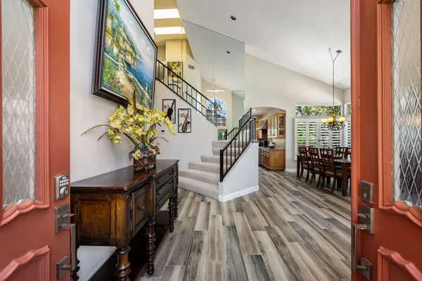 a living room with fireplace furniture and a large window