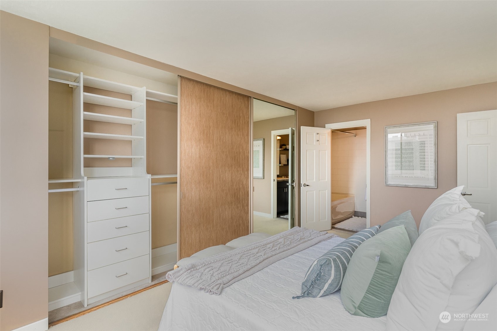 1120 8th Avenue, Unit 1601 Seattle, WA 98101 - Photo 12 of 30 a bedroom with a bed and a window